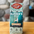 Load image into Gallery viewer, Box of Espresso Bay Blitzen&#39;s Blend coffee on a wooden surface with a stone wall background
