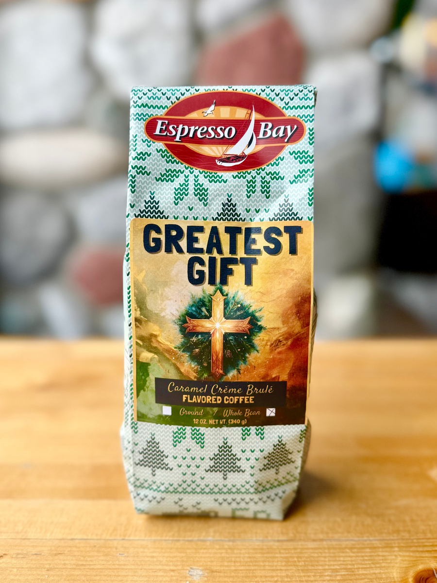 Espresso Bay coffee package with Christmas design on a wooden surface