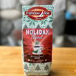 Load image into Gallery viewer, Espresso Bay Holiday Blend coffee package on a wooden surface with a blurred background
